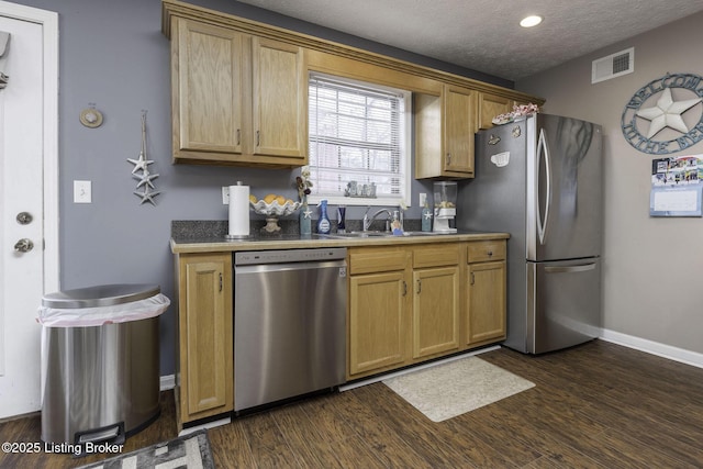 216 Willow Creek Dr, Mt Washington, KY 40047 - kitchen with a sink, visible vents, stainless steel appliances, baseboards, and dark wood-style flooring