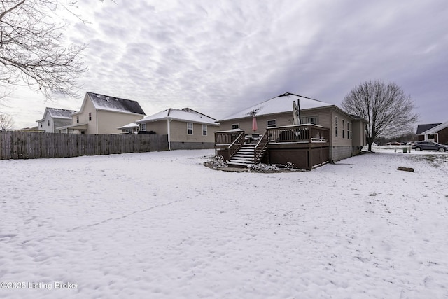 216 Willow Creek Dr, Mt Washington, KY 40047 - snow covered rear of property featuring a wooden deck, stairway, and fence