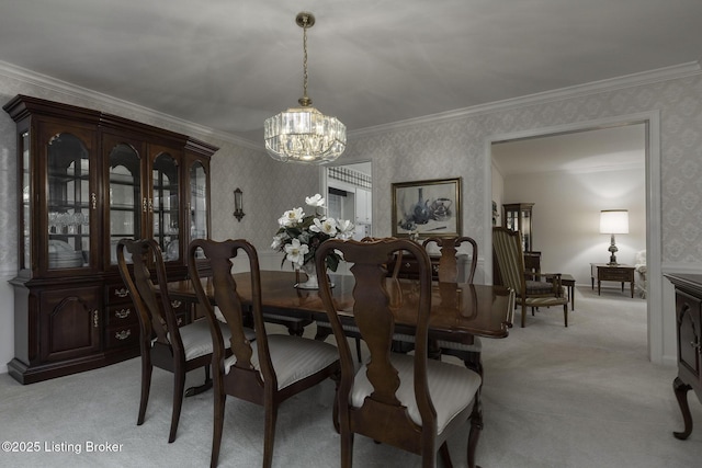 dining area featuring crown molding, wallpapered walls, a notable chandelier, and light carpet