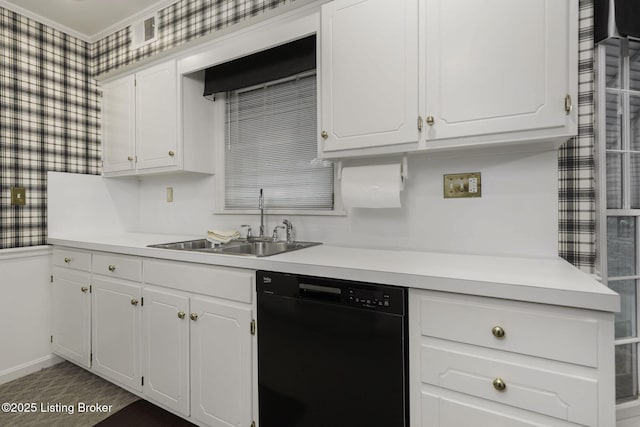 kitchen featuring a sink, white cabinets, and black dishwasher