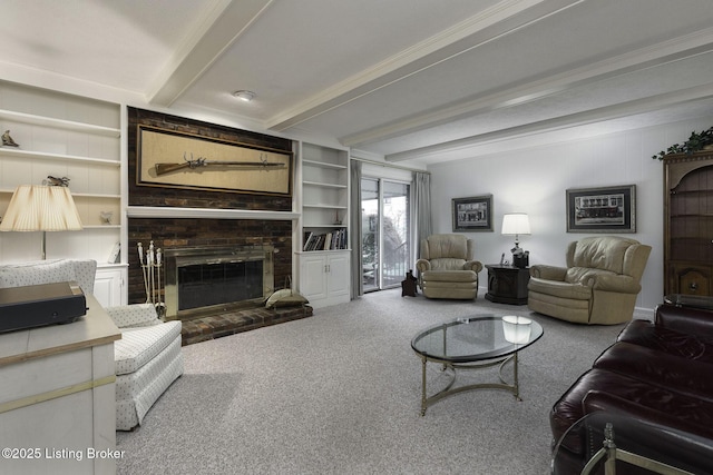carpeted living room with a brick fireplace, beam ceiling, and built in shelves