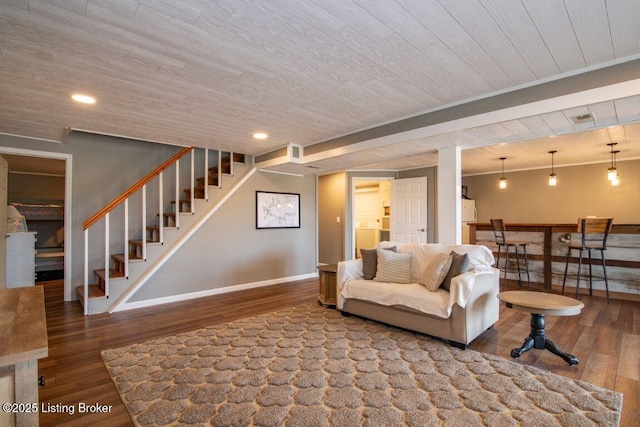 living area featuring wood finished floors, stairs, wood ceiling, baseboards, and visible vents