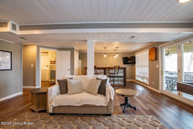 living area featuring baseboards, wooden ceiling, and wood finished floors