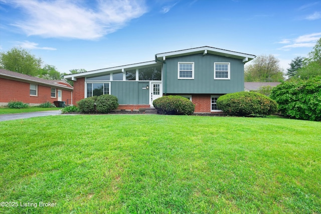2311 Langdon Dr, Louisville, KY 40242 - split level home with a front lawn and brick siding