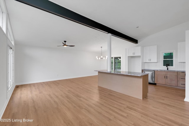 2311 Langdon Dr, Louisville, KY 40242 - kitchen with lofted ceiling with beams, dishwasher, light wood finished floors, and a sink