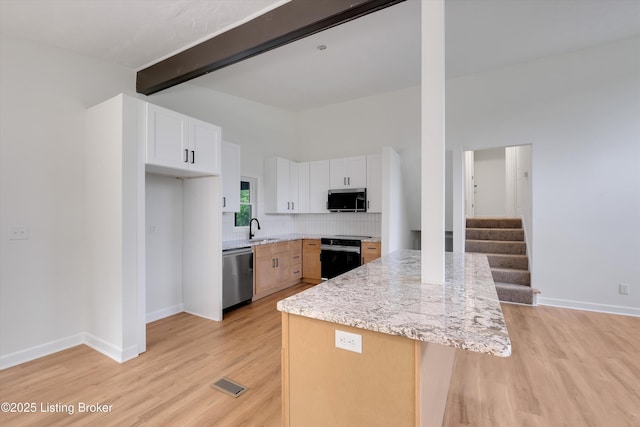 2311 Langdon Dr, Louisville, KY 40242 - kitchen with appliances with stainless steel finishes, visible vents, light wood-style floors, and a sink