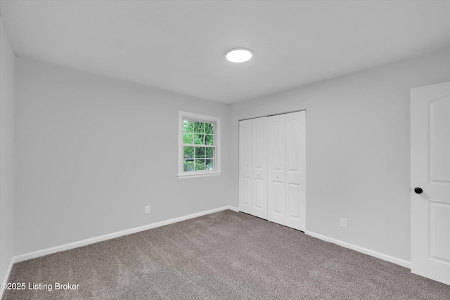 2311 Langdon Dr, Louisville, KY 40242 - unfurnished bedroom with baseboards, a closet, and carpet flooring