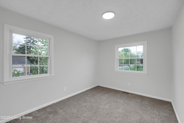 2311 Langdon Dr, Louisville, KY 40242 - carpeted empty room featuring baseboards, visible vents, and a healthy amount of sunlight