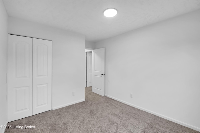 2311 Langdon Dr, Louisville, KY 40242 - unfurnished bedroom with a closet, carpet flooring, and baseboards