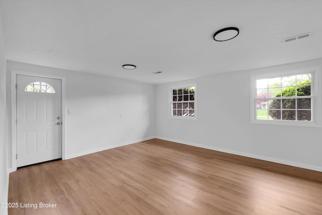 2311 Langdon Dr, Louisville, KY 40242 - foyer entrance with visible vents, light wood finished floors, and baseboards