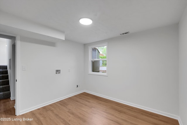 2311 Langdon Dr, Louisville, KY 40242 - spare room featuring stairs, visible vents, baseboards, and light wood-style floors