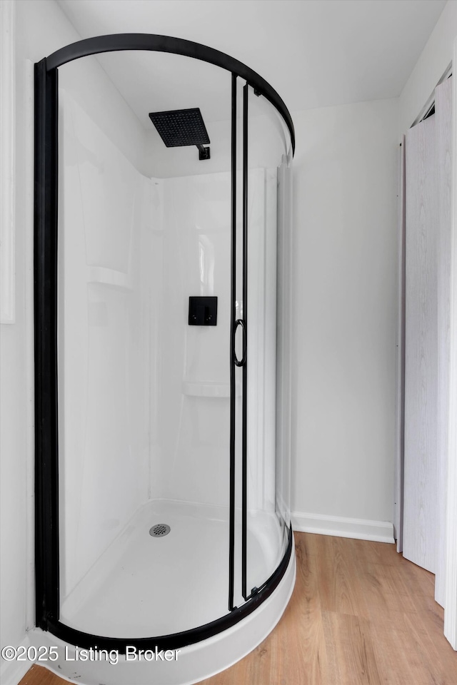 2311 Langdon Dr, Louisville, KY 40242 - bathroom featuring a stall shower, wood finished floors, and baseboards
