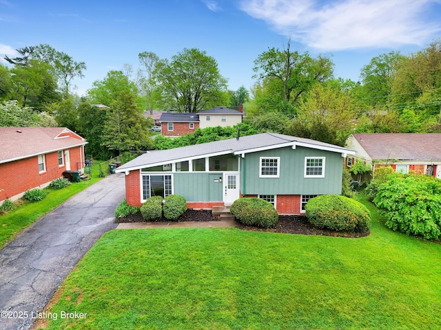 2311 Langdon Dr, Louisville, KY 40242 - view of front of house featuring brick siding and a front lawn