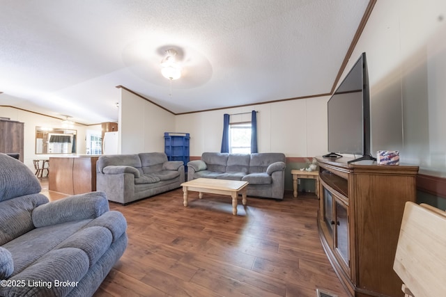 living area with a textured ceiling, ceiling fan, wood finished floors, and lofted ceiling