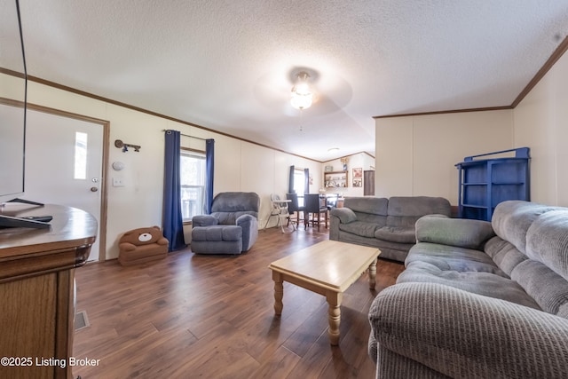 living room featuring crown molding, a textured ceiling, and wood finished floors
