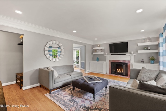 320 Biltmore Rd, Louisville, KY 40207 - living room featuring crown molding, light wood-type flooring, a fireplace, baseboards, and recessed lighting