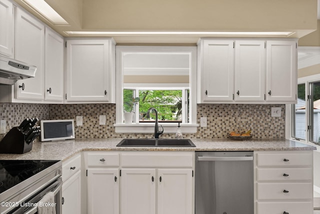 320 Biltmore Rd, Louisville, KY 40207 - kitchen with stainless steel appliances, a sink, white cabinetry, and backsplash