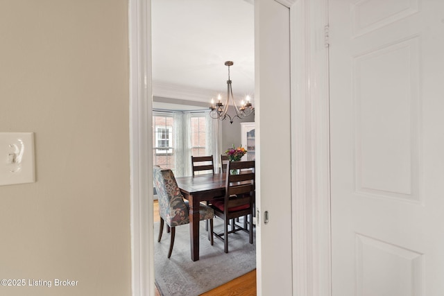 320 Biltmore Rd, Louisville, KY 40207 - dining area featuring a chandelier, light wood-style floors, and crown molding