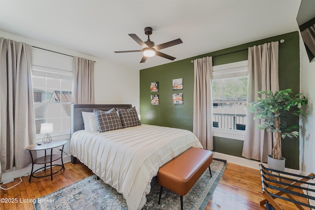 bedroom featuring ceiling fan and wood finished floors