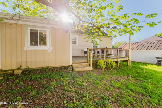 rear view of house featuring a deck