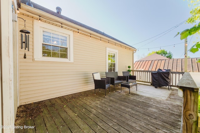 wooden deck with area for grilling