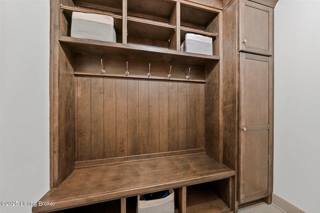 mudroom with wooden walls