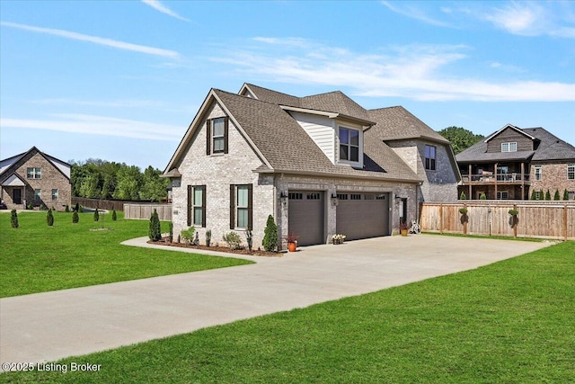 view of front of property with fence, a front yard, driveway, and brick siding