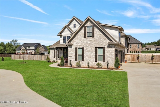 craftsman-style house featuring fence, concrete driveway, a front lawn, and brick siding
