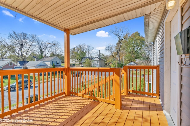 wooden terrace featuring a residential view