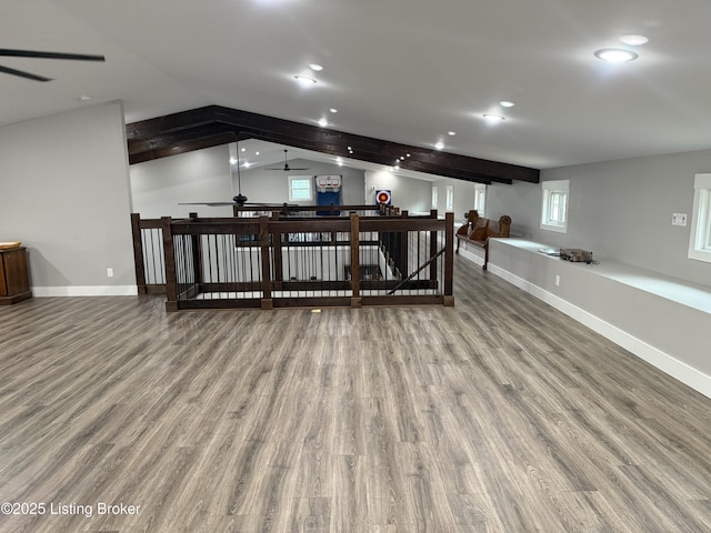 interior space featuring recessed lighting, a ceiling fan, and wood finished floors