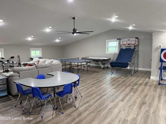 playroom with wood finished floors, a healthy amount of sunlight, a ceiling fan, and baseboards