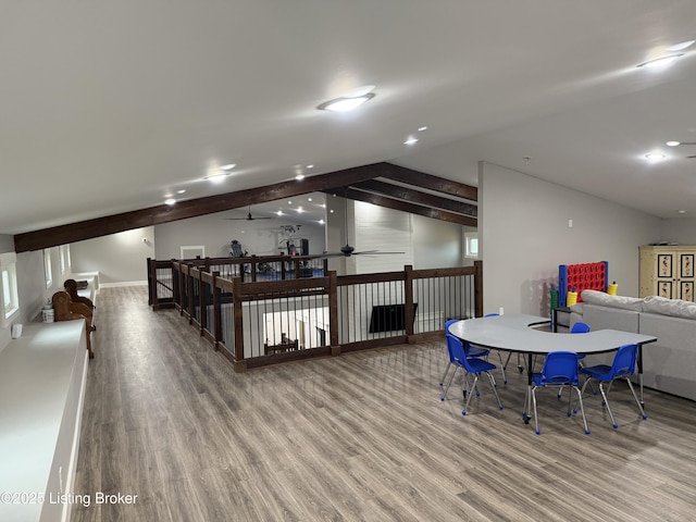 rec room featuring a ceiling fan, wood finished floors, and lofted ceiling