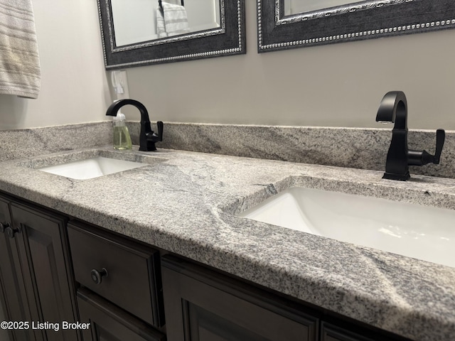 bathroom featuring double vanity and a sink