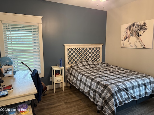 bedroom with dark wood finished floors