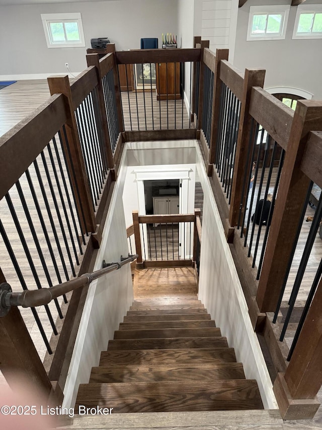 stairway with wood finished floors