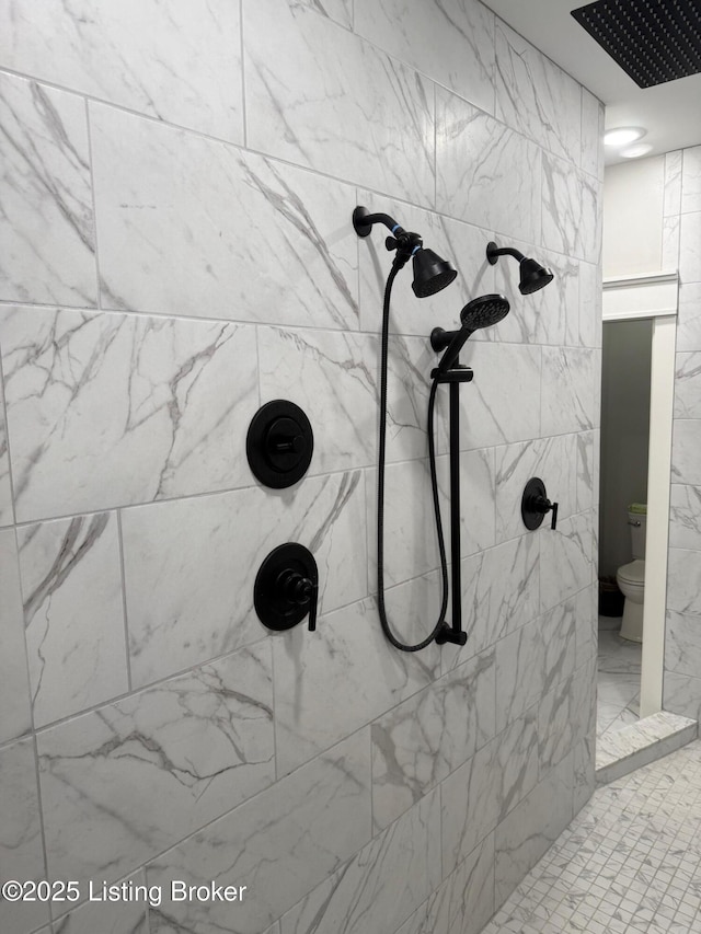 details with tiled shower and toilet