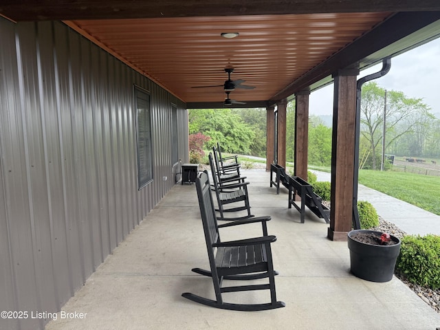 view of patio featuring ceiling fan and a porch