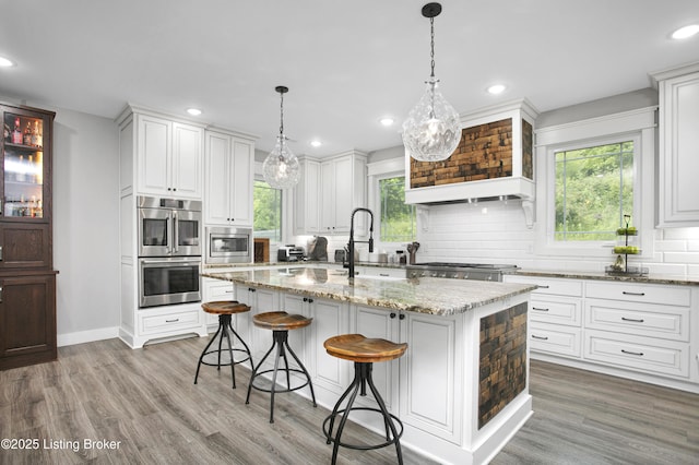 501 Shumate Ln, Bardstown, KY 40004 - kitchen with stainless steel appliances, tasteful backsplash, recessed lighting, light wood-style floors, and white cabinetry