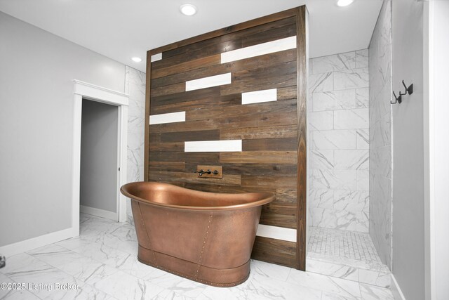 501 Shumate Ln, Bardstown, KY 40004 - bathroom featuring marble finish floors, wood walls, recessed lighting, a soaking tub, and an accent wall