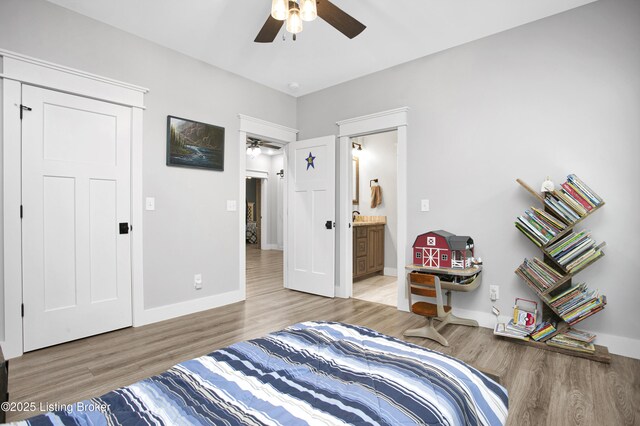 501 Shumate Ln, Bardstown, KY 40004 - bedroom with light wood finished floors, baseboards, connected bathroom, and ceiling fan