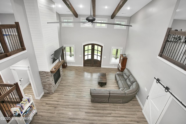 501 Shumate Ln, Bardstown, KY 40004 - living room featuring ceiling fan, baseboards, wood finished floors, beam ceiling, and a high ceiling