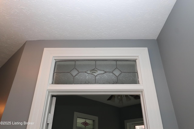 interior details with a textured ceiling