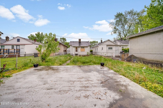 exterior space featuring fence and a residential view