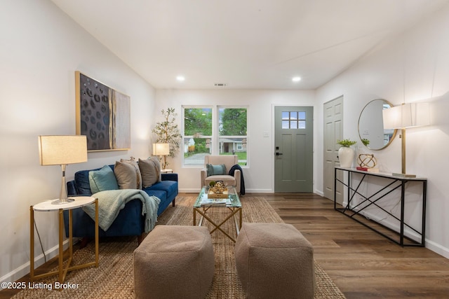 living area with visible vents, recessed lighting, baseboards, and wood finished floors