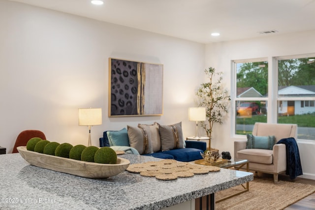 living room featuring visible vents, recessed lighting, and wood finished floors