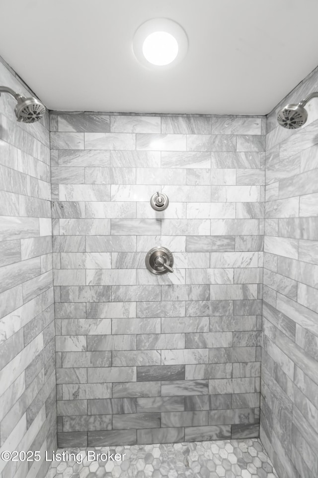 interior space featuring tiled shower