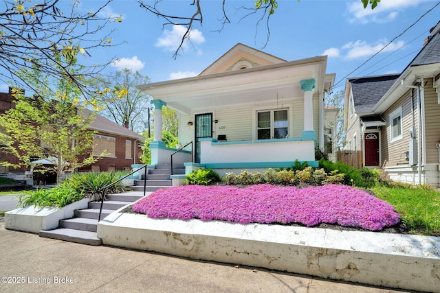 view of front of house with a porch and stairway