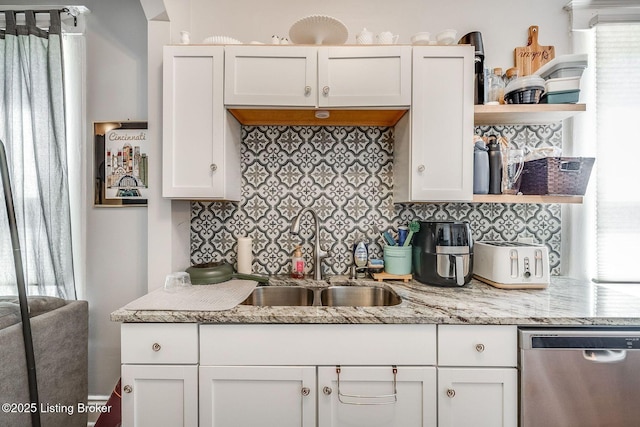 kitchen featuring open shelves, a sink, white cabinetry, decorative backsplash, and stainless steel dishwasher