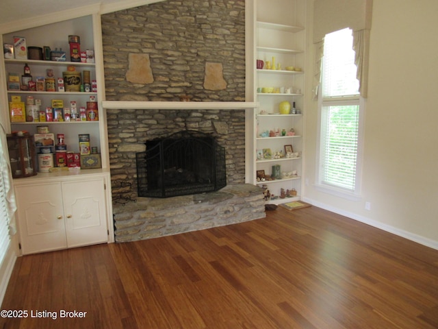 11802 Running Creek Rd, Douglass Hills, KY 40243 - unfurnished living room with wood finished floors, a stone fireplace, vaulted ceiling, baseboards, and built in shelves