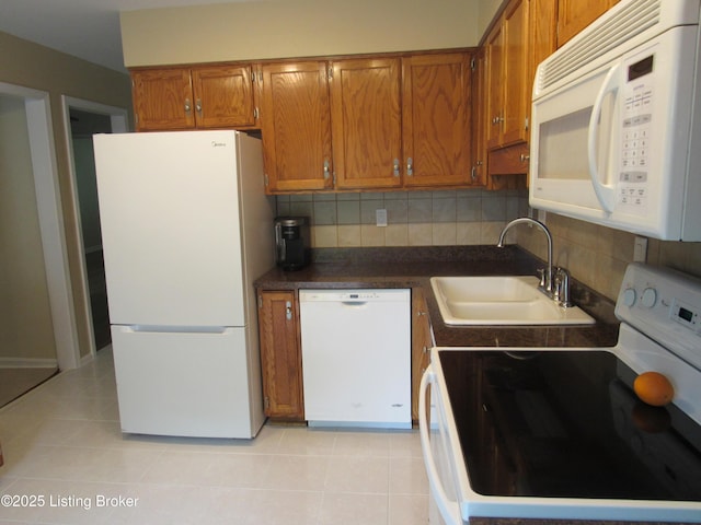11802 Running Creek Rd, Douglass Hills, KY 40243 - kitchen featuring white appliances, a sink, brown cabinetry, and light tile patterned floors